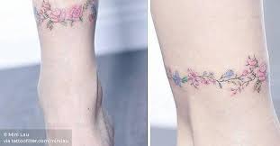 In hinduism and buddhism, the lotus flower is considered to be a symbol of the awakening of the spiritual reality of life. Floral Ankle Band Tattoo