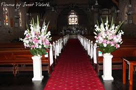 Fill each vase with a spray of flowers that match your color scheme. Church Wedding Flower Arrangements