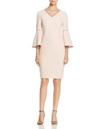Calvin Klein Reworks This Bloomingdale S Exclusive Dress With Modern Touches Integrating Bold Black Pip Flare Sleeve Dress Bell Sleeve Dress Pink Sheath Dress