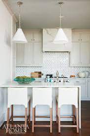 The Petite Kitchen Is Big On Style With A Custom Tiled New Ravenna Backsplash In A Flower Pa Kitchen Design Grey Kitchen Cabinets Andrew Howard Interior Design