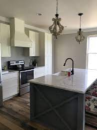 It's often paired with a white color, which is a perfect combination. Shiplap Island Gray Stain White Kitchen Open Floor Plan Farmhouse Sink Open Floor Plan Kitchen Shiplap Kitchen White Kitchen
