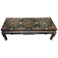 This small table from the 1950s, has as its basis a sculpture in gilded bronze, lost wax casting, depicting a dragon, the glass top is often two centimeters, the edge is chiseled by. 1950s Chinese Black Lacquer Painted Dragon Coffee Table Or Bench For Sale At 1stdibs