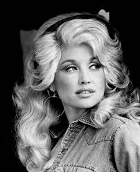 The day after she graduated high school in 1964, Dolly Parton left her home  in Tennessee's Great Smoky Mountains and boarded the first bus to Nashville  with a suitcase made of cardboard —