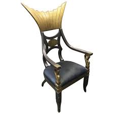 Entrenched buttons provide accent on the backrest, while fine stitching stresses its durability. 1934 Cleopatra Prop Egyptian Throne Chair Used By Claudette Colbert Chairish