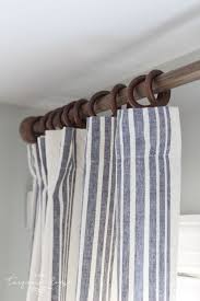 Apron length curtains are not too long, hanging just below the window sill, or to the bottom of the window trim (known as the apron). New Curtains And A Budget Friendly Curtain Ring Hack