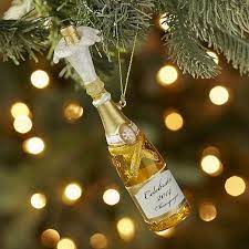 While it's too late to order anything for arrival by christmas at this point, it's never too late to find the perfect gift — even if that means it's a little belated. Glass Champagne Bottle Ornament