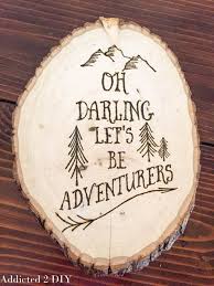 This large wooden wall art features a picture of a mountain sunrise. Wood Burned Wall Art Addicted 2 Diy
