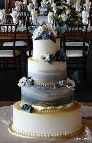 Buttercream Icing With Hand Painted Edible Gold Accents Garnished With Gum Paste Flowers Lake Cake Diy Wedding Cake Party Cakes