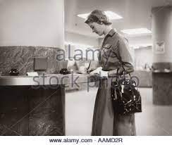 Check spelling or type a new query. 1950s 1960s Woman Handbag On Arm Gloves Filling Out Deposit Slip Bank Counter Stock Photo Alamy