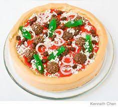 A deep dish chocolate chunk cookie cake topped with melted ganache chocolate and finished off with toasty warm marshmallows. Parenting Pizza Birthday Cake Design