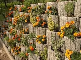 Place another 1×4 board on edge for spacer. Retaining Wall Ideas Concrete Planters As A Supporting Structure In Garden