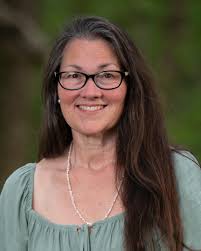 7th grader signs the scale fish