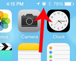 The alarm clock icon got the boot. What Is The Clock Icon At The Top Of My Iphone Screen Solve Your Tech