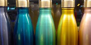 Most of the wood and metal options aren't solid and would allow shorter water bottles to fall through, but these solid plastic are perfect and they come in white or clear. How To Best Clean And Sanitize Your Water Bottle Today