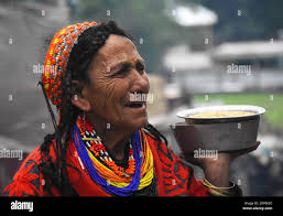 180518) -- KALASH VALLEY (PAKISTAN), May 18, 2018 -- Photo taken on May 14,  2018 shows a Kalash woman wearing traditional colorful costumes in Kalash  Valley in northwest Pakistan s Chitral District.