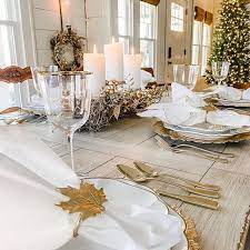 Tortoise and conch shells accessorize this coastal living room, while starfish adorn the mantel. Simple Holiday Table Setting Simply Southern Cottage Simple Christmas Decor Holiday Table Settings Southern Cottage