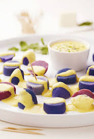 Peruvian Purple Potato Papa A La Huancaina Appetizer Spicy Cheesy Potato Goodness Peruvian Recipes Peruvian Cuisine Peruvian Dishes