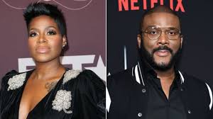 The phrase free yourself, a tootsie roll candy, her mother's name diane, two dollar signs, a rosary bead necklace. The Truth About Tyler Perry And Fantasia Barrino S Relationship