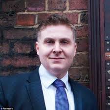 Journalist Andre Walker poses with sword in ISIS taunt