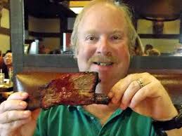 Holding a CROWN PRIME BEEF RIB