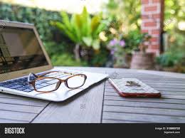 Maybe you're sitting in your favorite spot with a cup of tea, enjoying a relaxing morning because you don't have to commute. Work Home Garden Image Photo Free Trial Bigstock