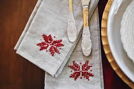 Cross stitching is enjoying a resurgence in popularity as crafters look for different ways to express their creativity. How To Make Poinsettia Cross Stitch Napkins For Your Holiday Party Hgtv