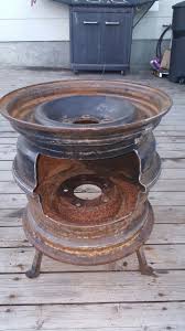 Firepit Made Of Tire Rims And Rail Road Spikes Just Add High Heat Paint Diy Wood Stove Rim Fire Pit Fire Pit Grill