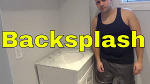 Wondering whether you should make a bathroom vanity backsplash part of your bathroom design or not? Installing A Bathroom Vanity Backsplash With Tile Glue Marble Youtube