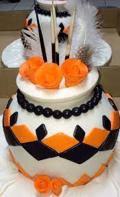 White flower wedding cake w/ black frosting. African Pot Wedding Cake African Wedding Cakes Traditional Wedding Cakes African Cake