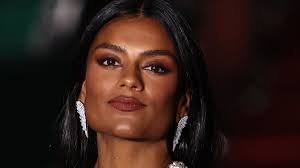 Bridgerton beauty Simone Ashley sparkles in the spotlight in a beaded mesh  dress at Vogue World Show