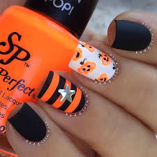 Black And White Striped Nails Halloween Matte Neon And More Stripes Jack O Lantern Nails Featuring Salon Perfect Cute Halloween Nails Halloween Nail Designs Fall Nail Art Designs