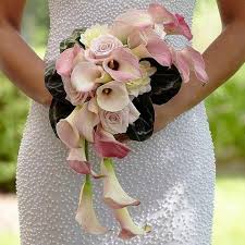 Talk to a florist about other flowers that are popular for wedding bouquets. Pink Cascade Wedding Bouquet Wedding Flowers By Proflowers Pale Pink Calla Lillies Roses And Dahli Flower Bouquet Wedding Wedding Bouquets Bridal Bouquet