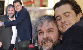 Orlando Bloom gives Peter Jackson a hug as he receives star
