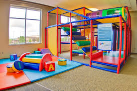 The Play Area Is A Glass Enclosed Children S Play Area Near The Cafe This Space Provides Fun And Engaging Equi Indoor Play Areas Kids Play Area Daycare Design
