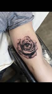The most famous design depicts a rose growing out of a skull's eye sockets. Eye Into Rose Tattoo Eyeball Tattoo Tattoos Flower Tattoo Sleeve