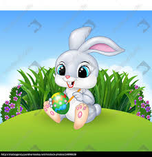 Happy easter 2018 quotes sayings wishes messages, happy easter images, easter bunny pictures, easter eggs pics, photos, wallpapers, coloring pages, memes, jokes, basket ideas. Cute Easter Bunny Painting An Egg On The Meadow Royalty Free Image 24898638 Panthermedia Stock Agency