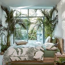 A cool tapestry will give your wall an artistic vibe. 12 Dreamy Tropical Bedroom Ideas Find The Ultimate Tropical Vibe In Your Room Jordlinghome
