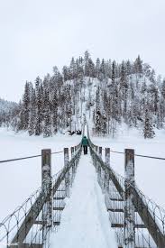 Woman Crossing A Suspension Bridge In A Snowy Oulanka National Park Finland Free Image By Rawpixel Com Jack Anstey