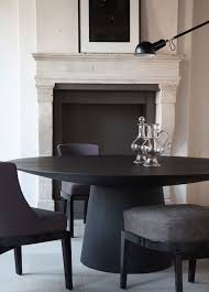 10 Striking Black Dining Tables For Your Modern Dining Room Black Round Dining Table Dining Table Black Minimalist Dining Room