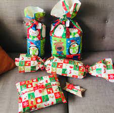 Use your own embellishments to personalize a plain bag to express your personal style. Wrapping Presents Without Boxes 5 Ways The How To Duo