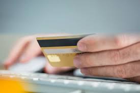 How to pay using debit card. Man Making Online Payment With Credit Card Close Up Stockphoto