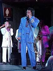 The best showman and one of the most influential singers of the 20th century, who transformed r&b into funk with his tight, driving style. James Brown Wikipedia