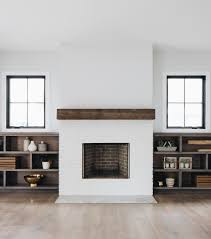 The soaring shiplap fireplace with brick fireplace surround and reclaimed wood beam mantle give this living room and extra layer of beauty. Black And White Modern Farmhouse Exterior Home Bunch Interior Design Ideas