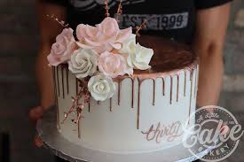 At cakeclicks.com find thousands of cakes categorized into thousands of categories. Rose Gold Drip Cake With Sugar Flowers Custom Birthday Cakes Sweet 16 Birthday Cake White Birthday Cakes