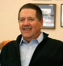 Professor Larry Held with his final graduate student, Tanya Madden,  following graduation ceremonies this spring. see sTory Page