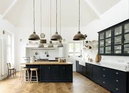 White and navy kitchen features iron and glass cage lanterns over. 10 Navy Blue Cabinets You Ll Fall In Love With Purewow