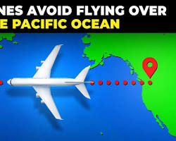 Image of plane flying over the Pacific Ocean