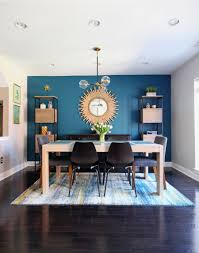 A Cozy Modern Dining Room In The Heart Of Philadelphia The Teal Accent Wall Paired With Accent Walls In Living Room Dining Room Accent Wall Teal Accent Walls