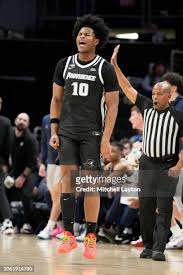 Rich Barron of the Providence Friars celebrates a shot in the first... News  Photo