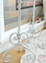 These chic candle holders have a slender arched handle on the top and feature a fun curved, openwork design. Upcycled Shabby Chic Tall Wrought Iron Candle Holders Interior Frugalista